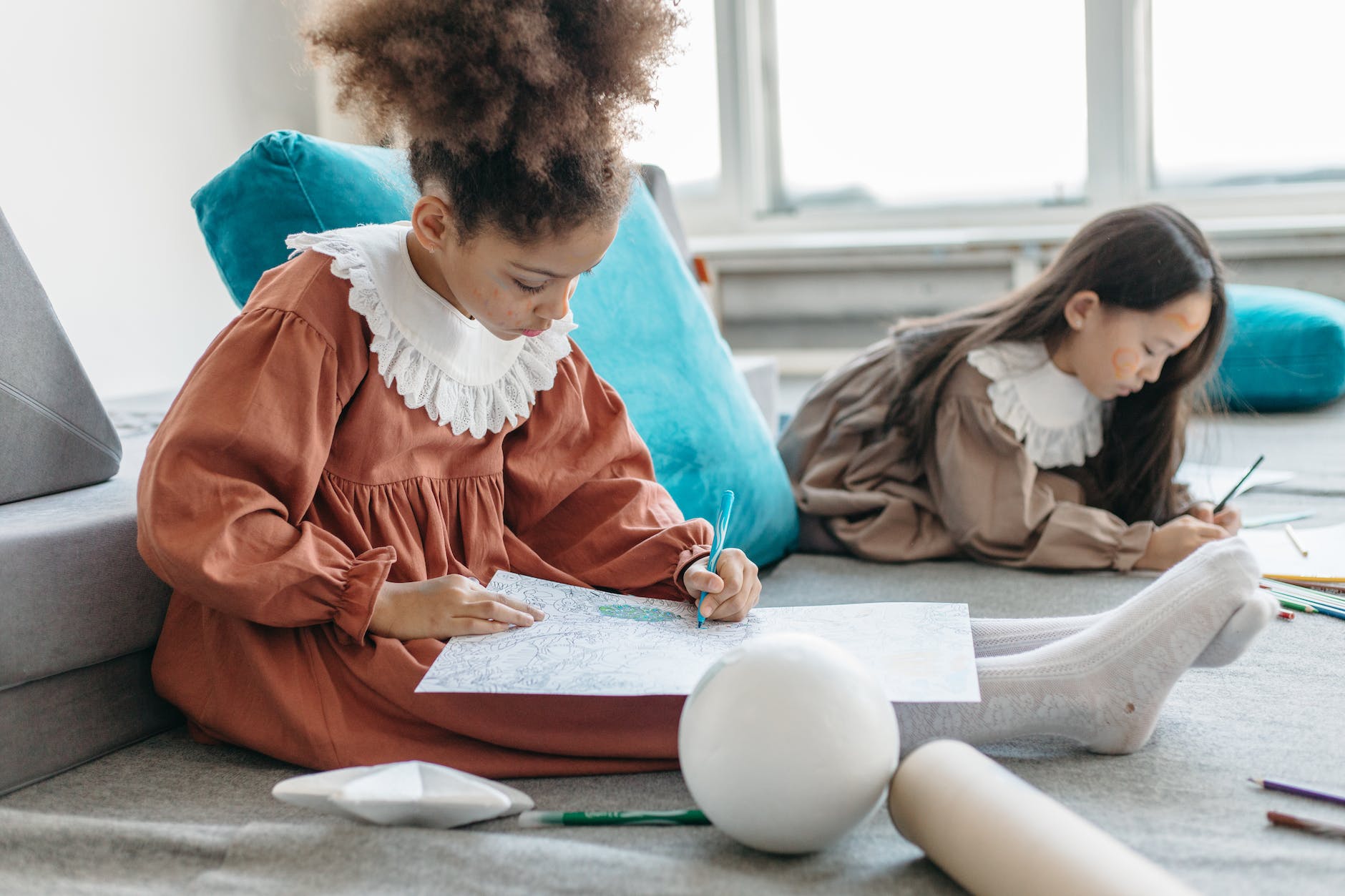 pexels-photo-6966376 The State digest 9 Puzzle games for kids: girl in red dress sitting on red textile